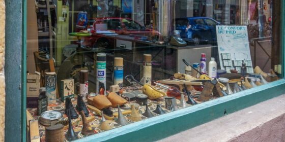 a store window with a variety of items in it