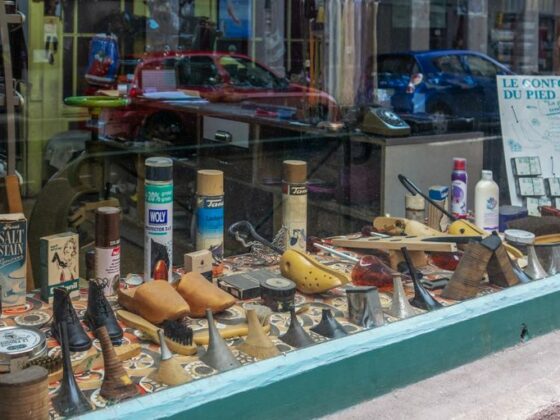 a store window with a variety of items in it